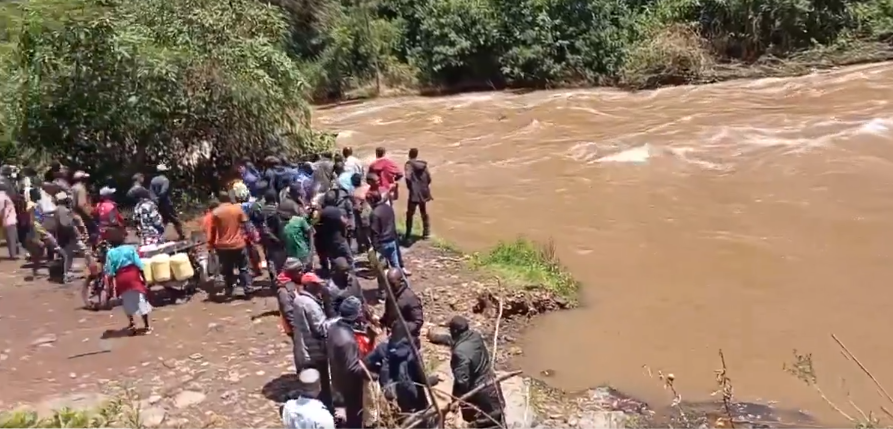 A screengrab image of Bomet locals at a river.
